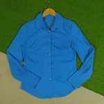Blue women's button-down shirt front view