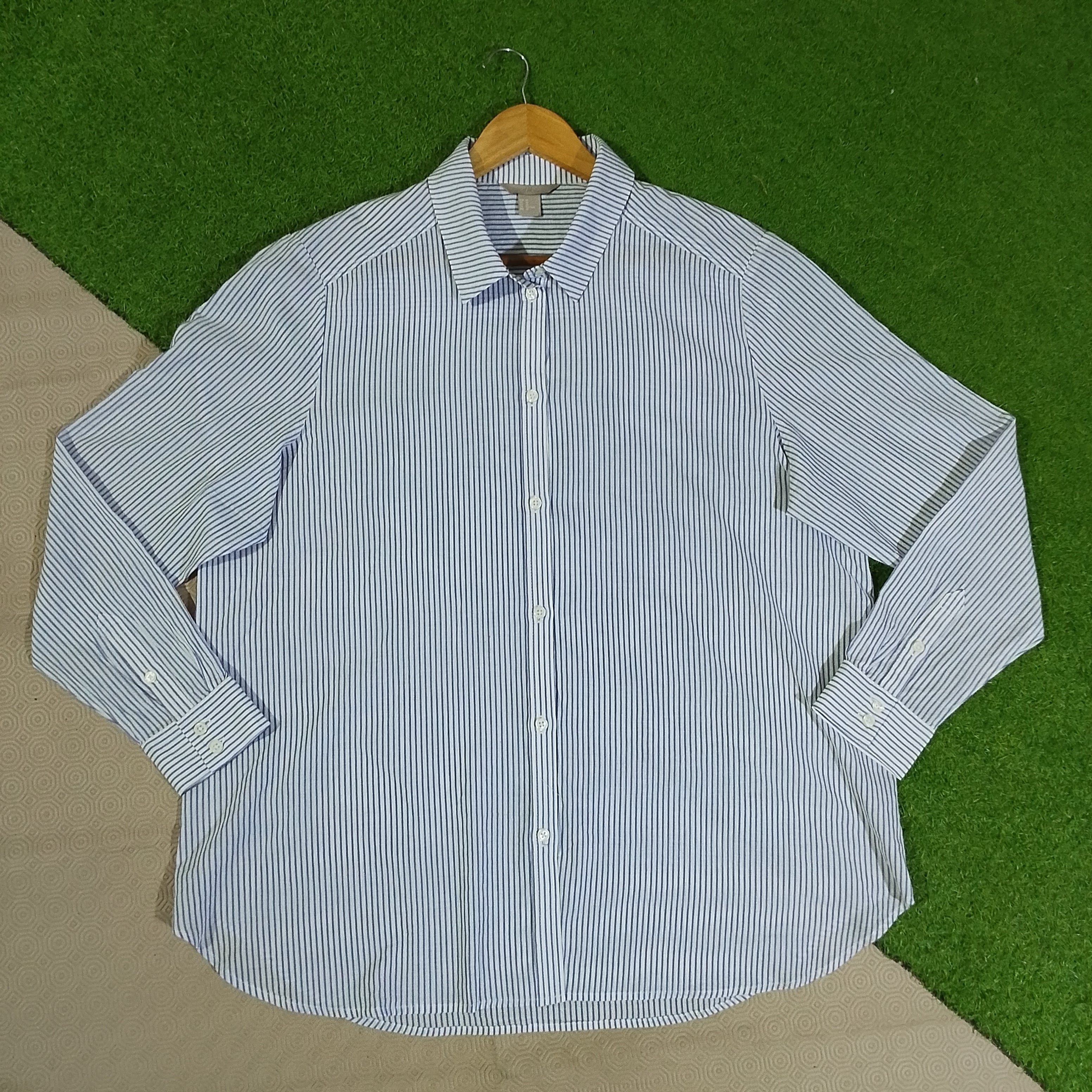 White and navy vertical pinstripe button-front shirt with collar