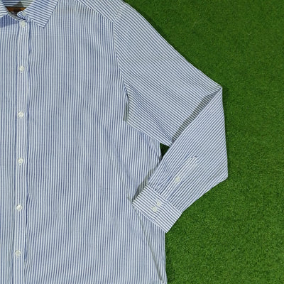 Close-up of white and navy pinstripe shirt with button front - alternate view