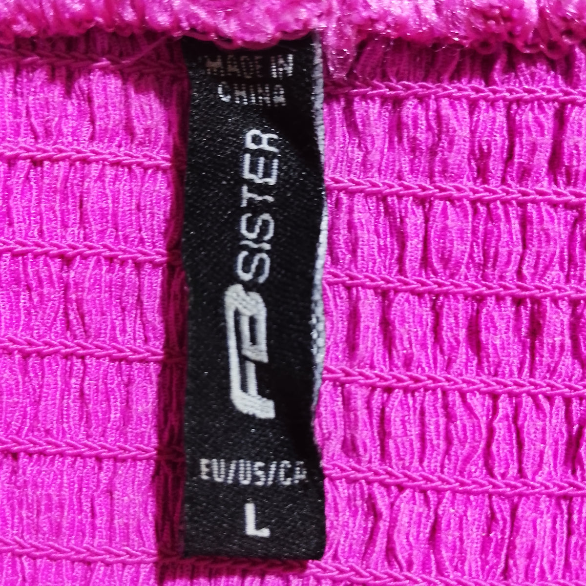 Fuchsia L Sisters brand and size label