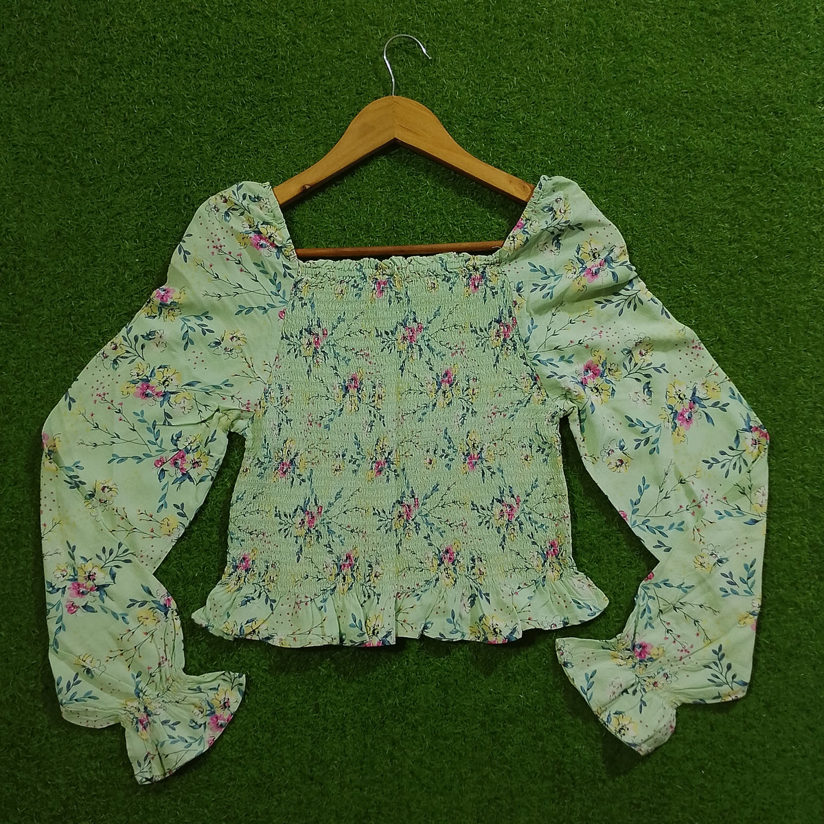 Sage green floral smocked crop top back view