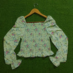 Sage green floral smocked crop top back view