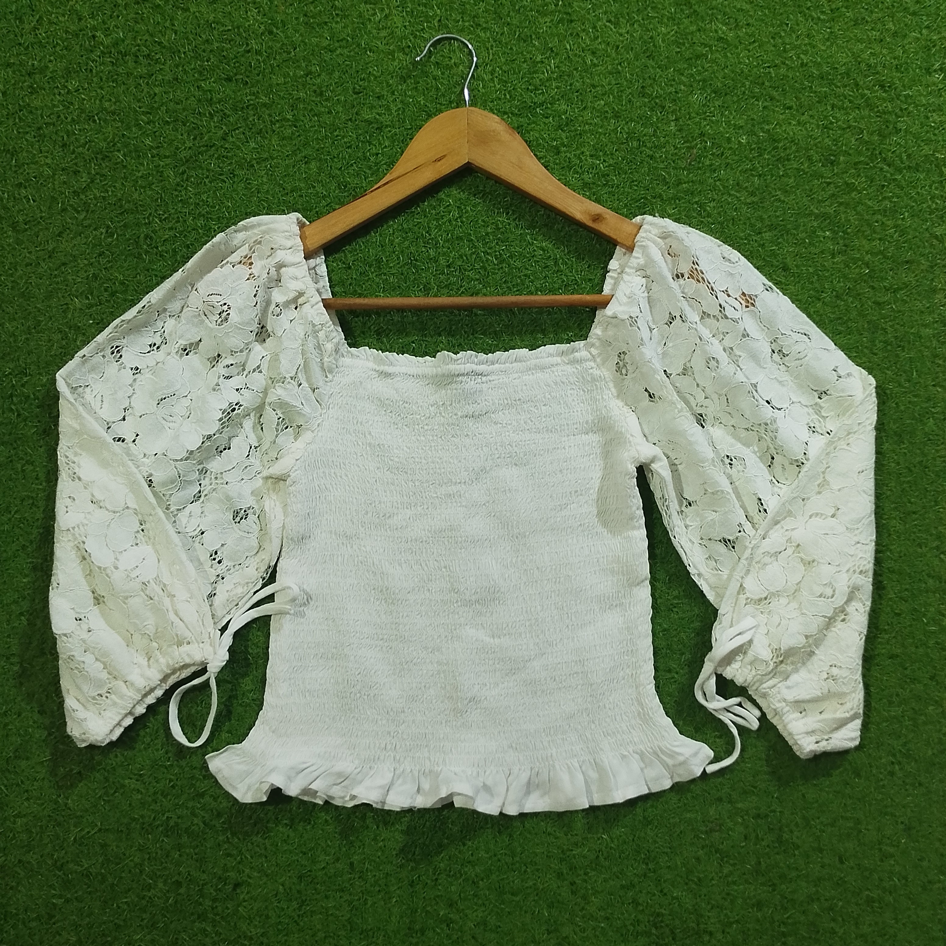 White lace sleeve smocked crop top front view