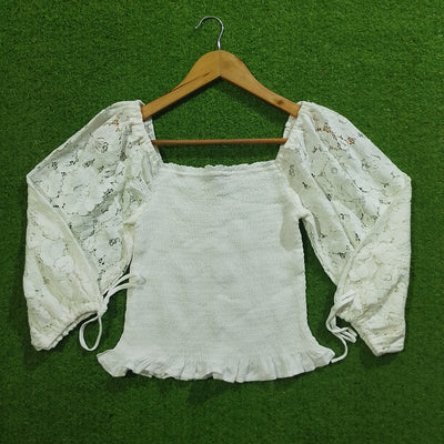 White lace sleeve smocked crop top front view