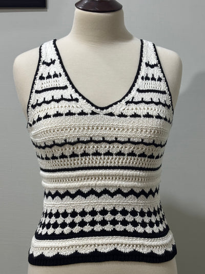Front of black and white striped openwork sleeveless V-neck top