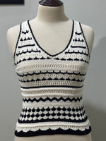 Front of black and white striped openwork sleeveless V-neck top