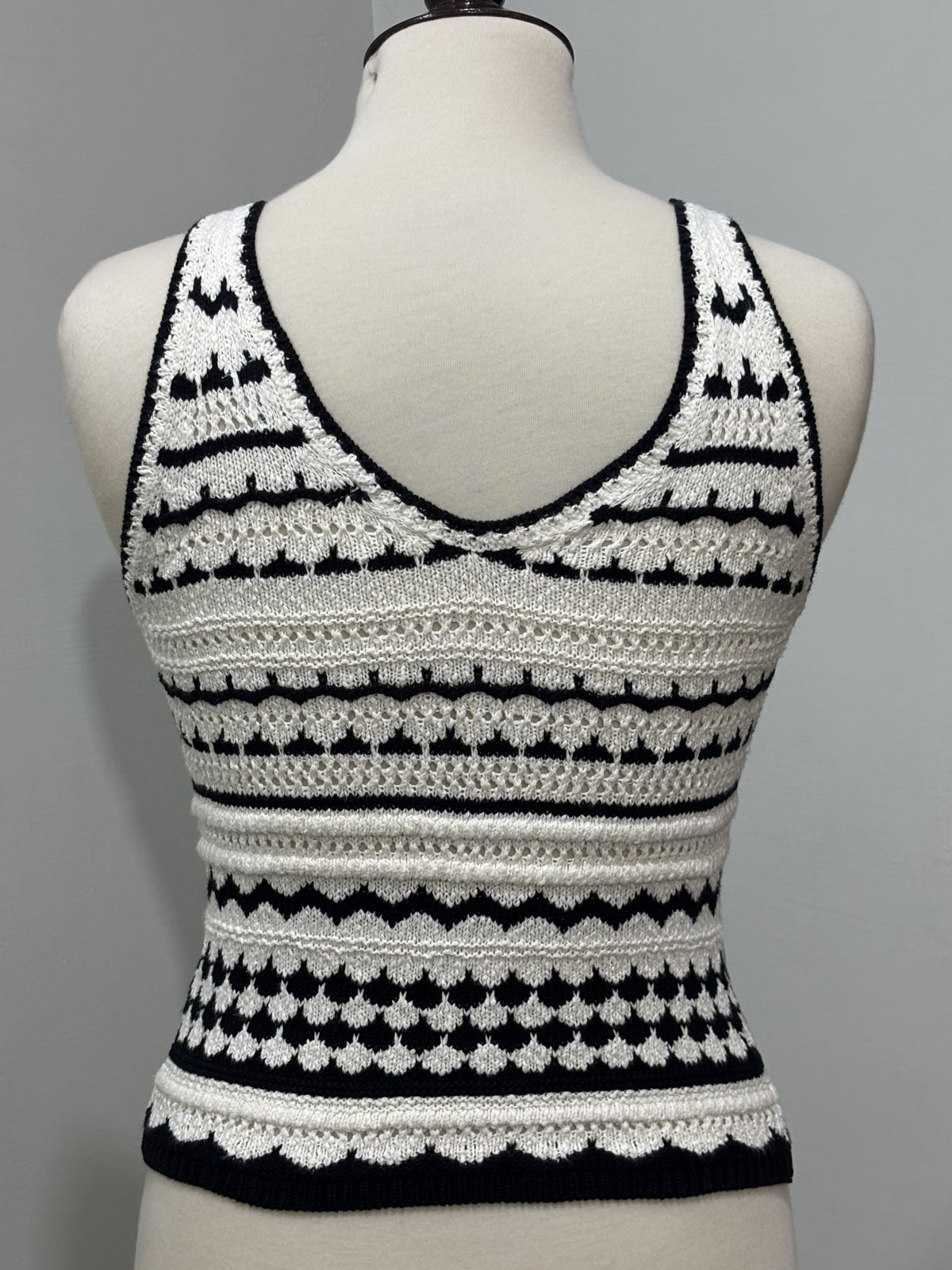 Back of black and white textured striped sleeveless top