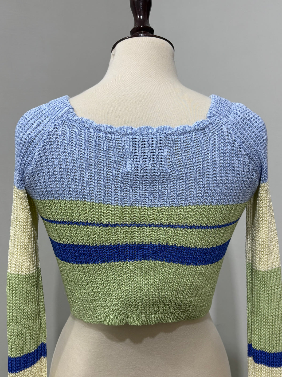 Close-up of square neckline and striped textured design