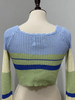 Close-up of square neckline and striped textured design