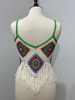 Back of cream and multicolor floral crochet top with long fringe