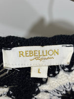 Rebellion garment label showing size L