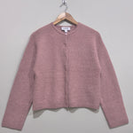 Dusty pink round-neck button-front cardigan with dropped shoulders, long sleeves and a straight hem.