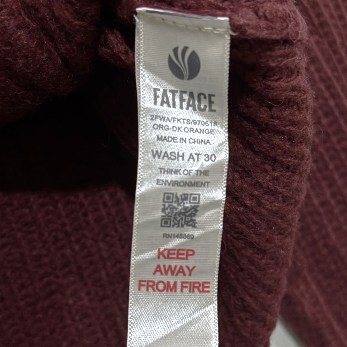 FatFace cardigan care label with washing instructions.