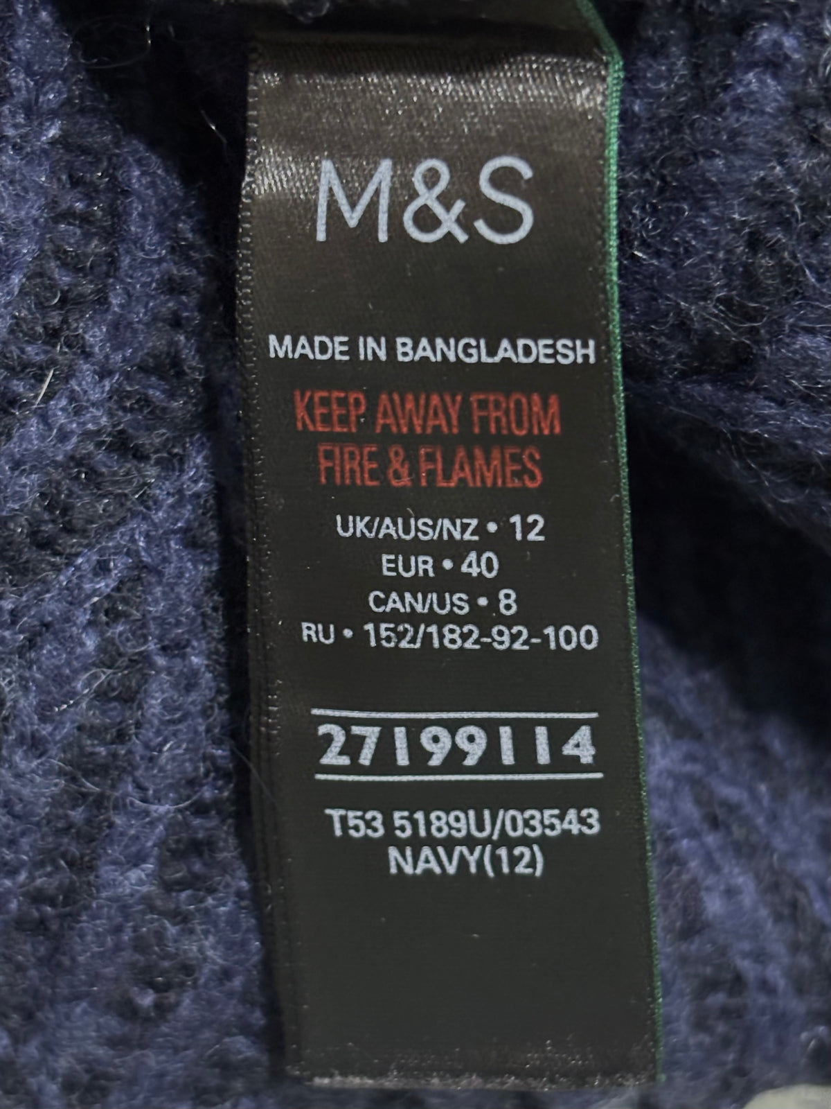M&S navy cardigan label showing UK/AUS/NZ 12, EUR 40 and CAN/US 8.