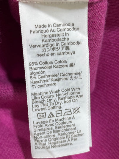 Fabric care label stating 95% cotton and 5% cashmere, made in Cambodia. - alternate view