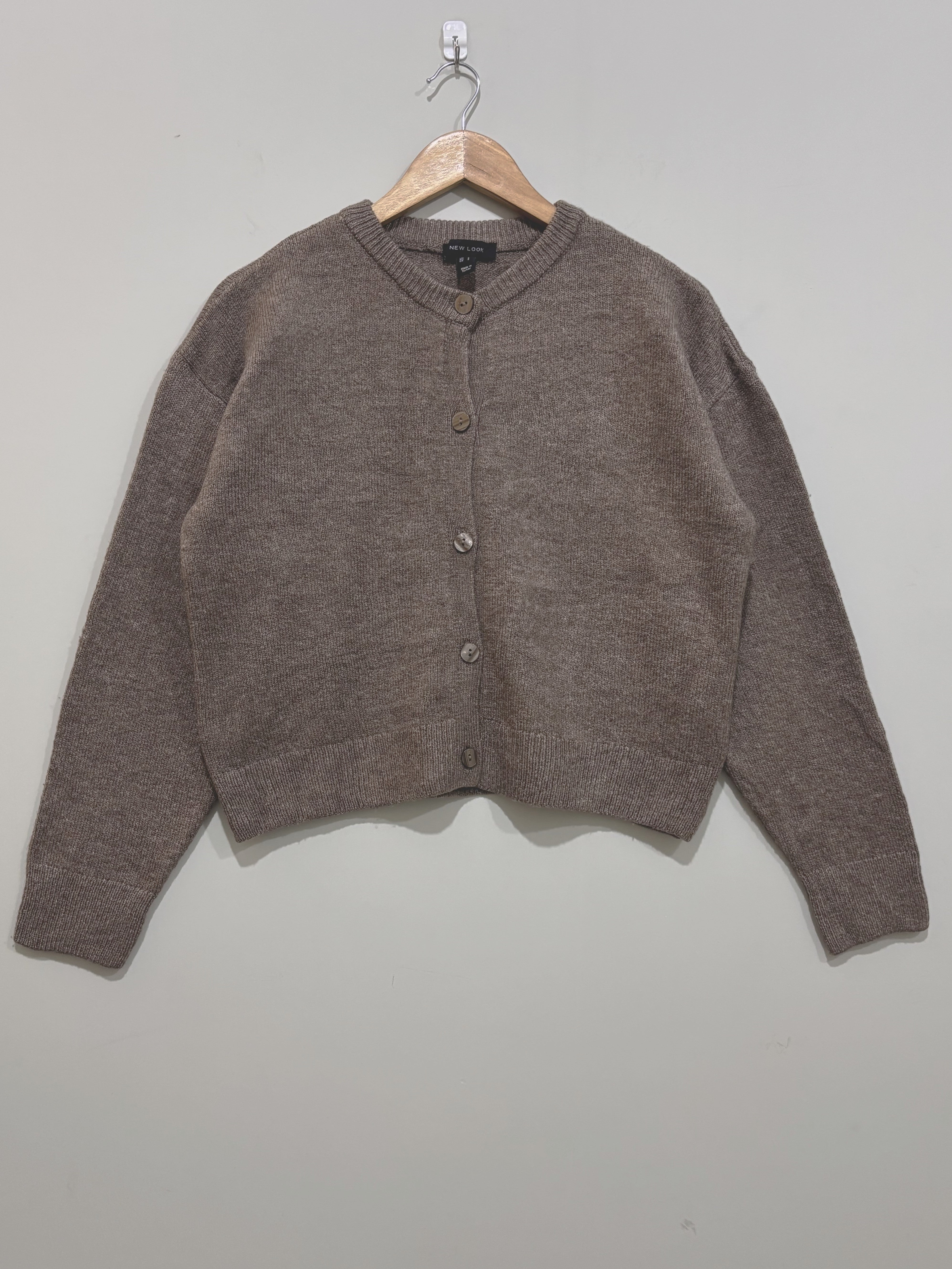 Taupe button-front cardigan with a round neckline, dropped shoulders, long sleeves and ribbed cuffs and hem.