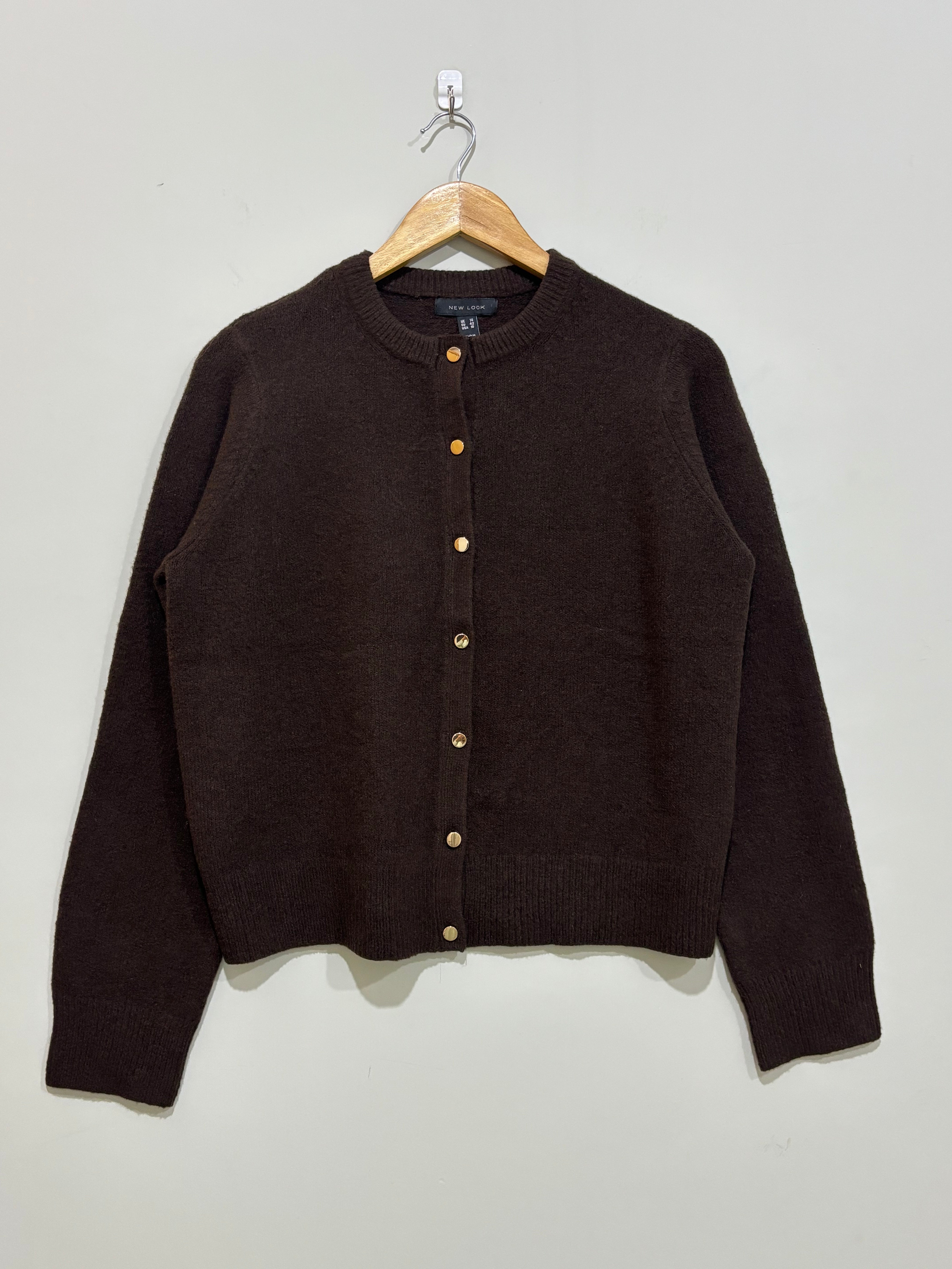 Dark brown round-neck cardigan with gold-tone front buttons, long sleeves and ribbed cuffs and hem.