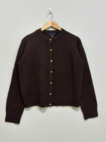Dark brown round-neck cardigan with gold-tone front buttons, long sleeves and ribbed cuffs and hem.