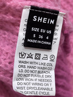 SHEIN cardigan label showing size S, EU 36 and US 4, with care instructions.