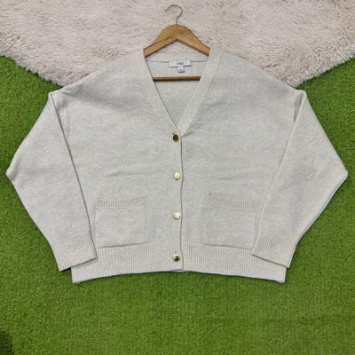 Light natural V-neck cardigan with dropped shoulders, four gold-tone buttons, two patch pockets and ribbed cuffs and hem.