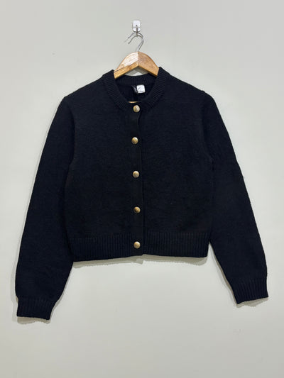 Black cropped round-neck cardigan with five gold-tone front buttons, long sleeves and ribbed cuffs and hem.