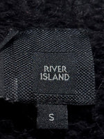 River Island clothing label with a separate size S tag.