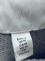 H&M garment label showing EUR M and US M.