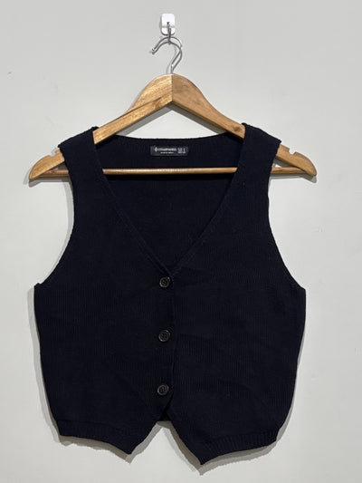 Black ribbed V-neck sleeveless vest with three-button front and pointed hem