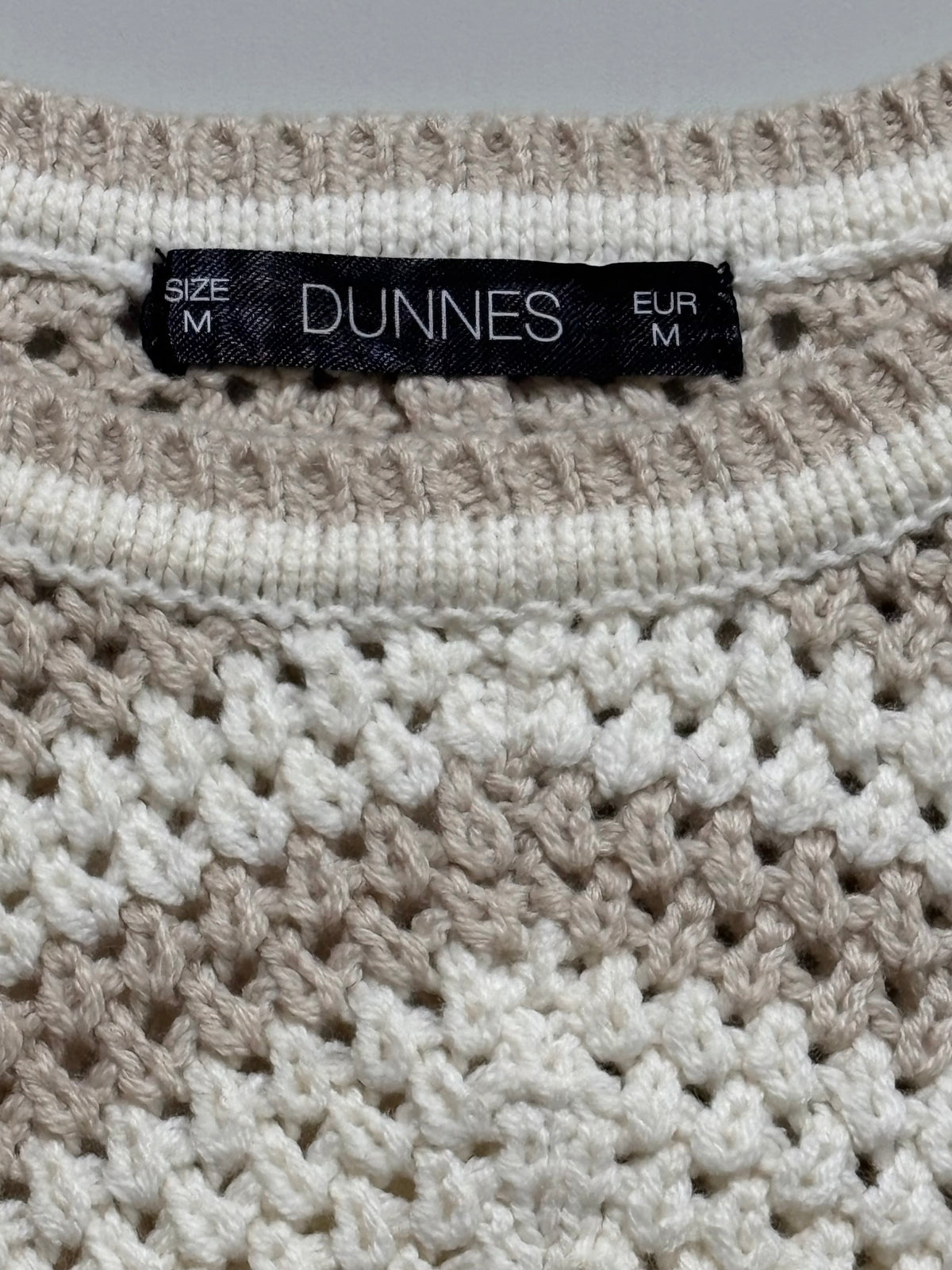Dunnes label showing size M and EUR M