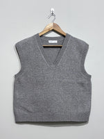 Grey sleeveless V-neck sweater vest with ribbed neckline, armholes and hem