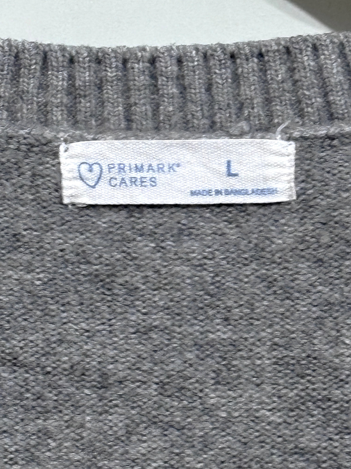 Primark Cares label showing size L