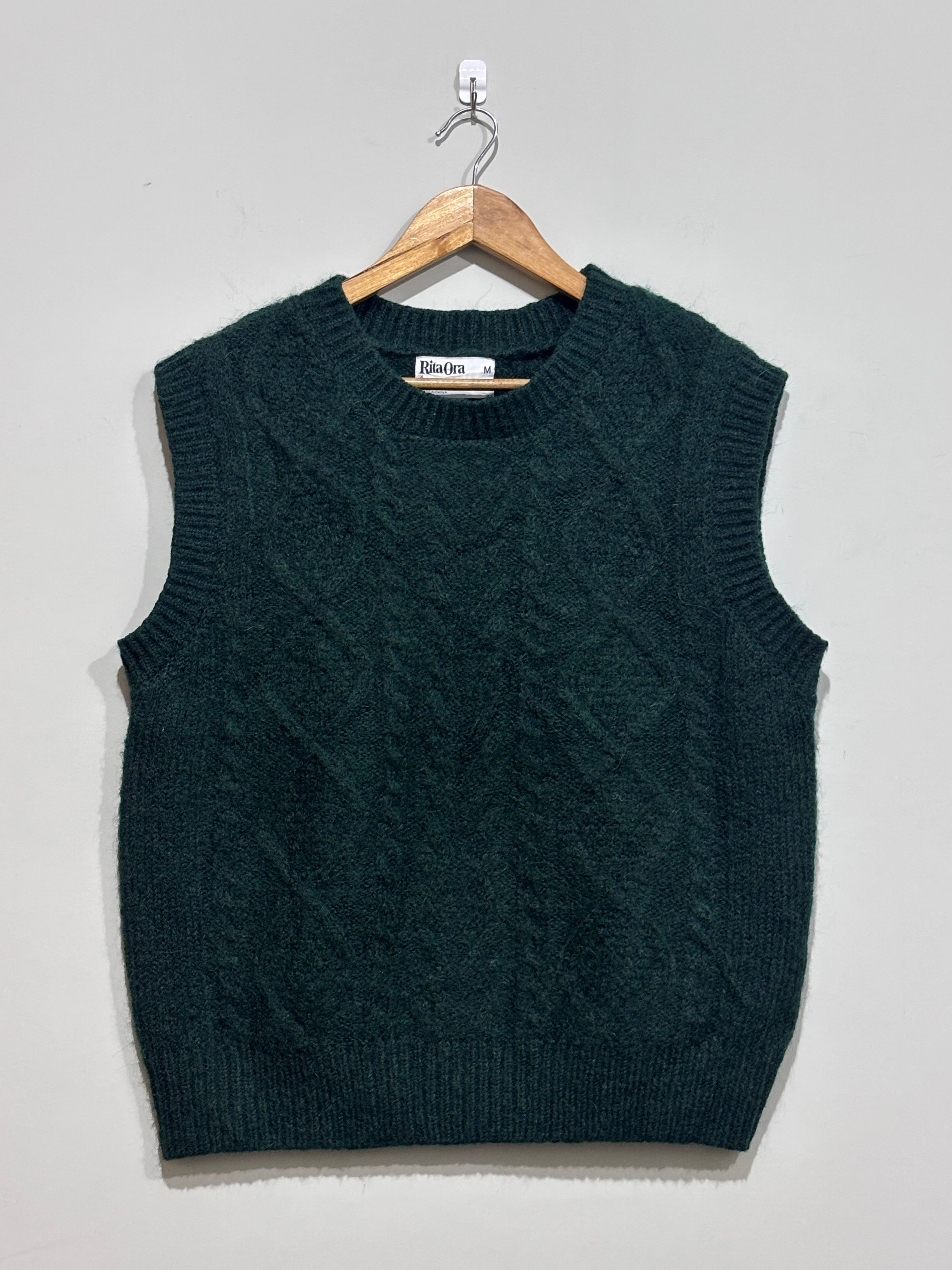 Dark green textured crew-neck sleeveless sweater vest with ribbed trim