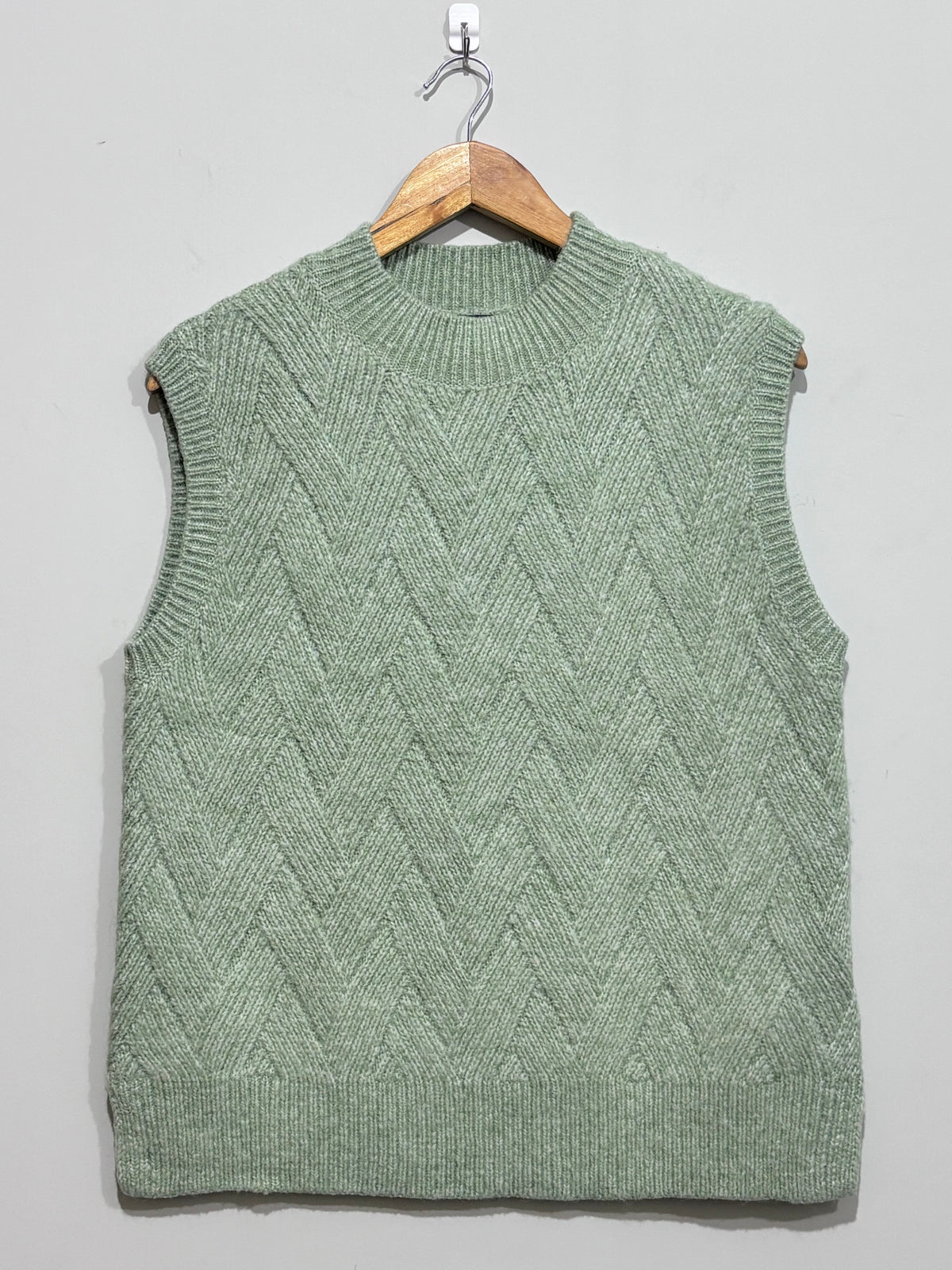 Pale jade chevron-textured crew-neck sweater vest with ribbed edging