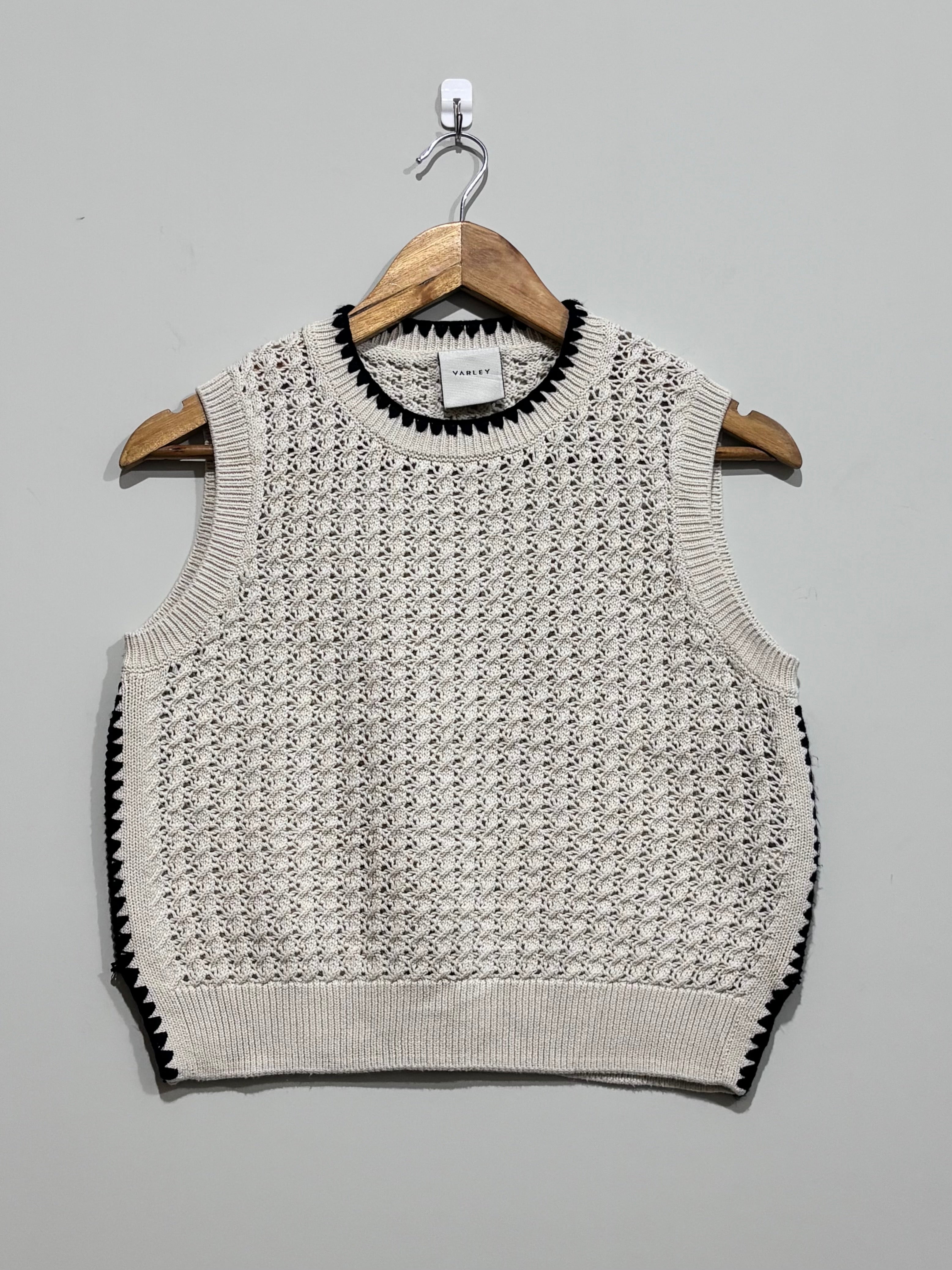 Cream open-knit Varley sweater vest with black contrast stitching at the crew neckline and sides