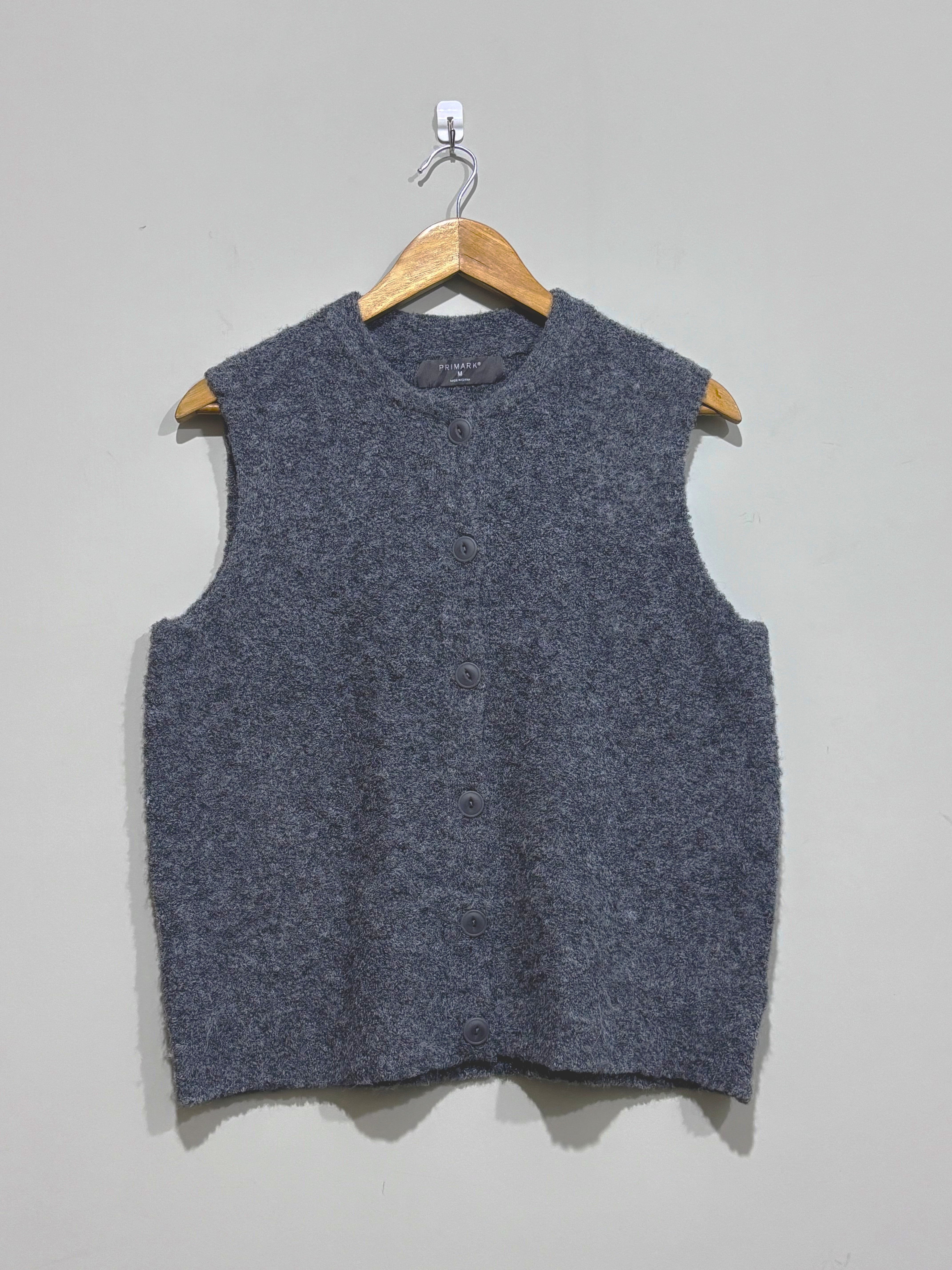 Grey textured sleeveless round-neck sweater vest with button-front fastening