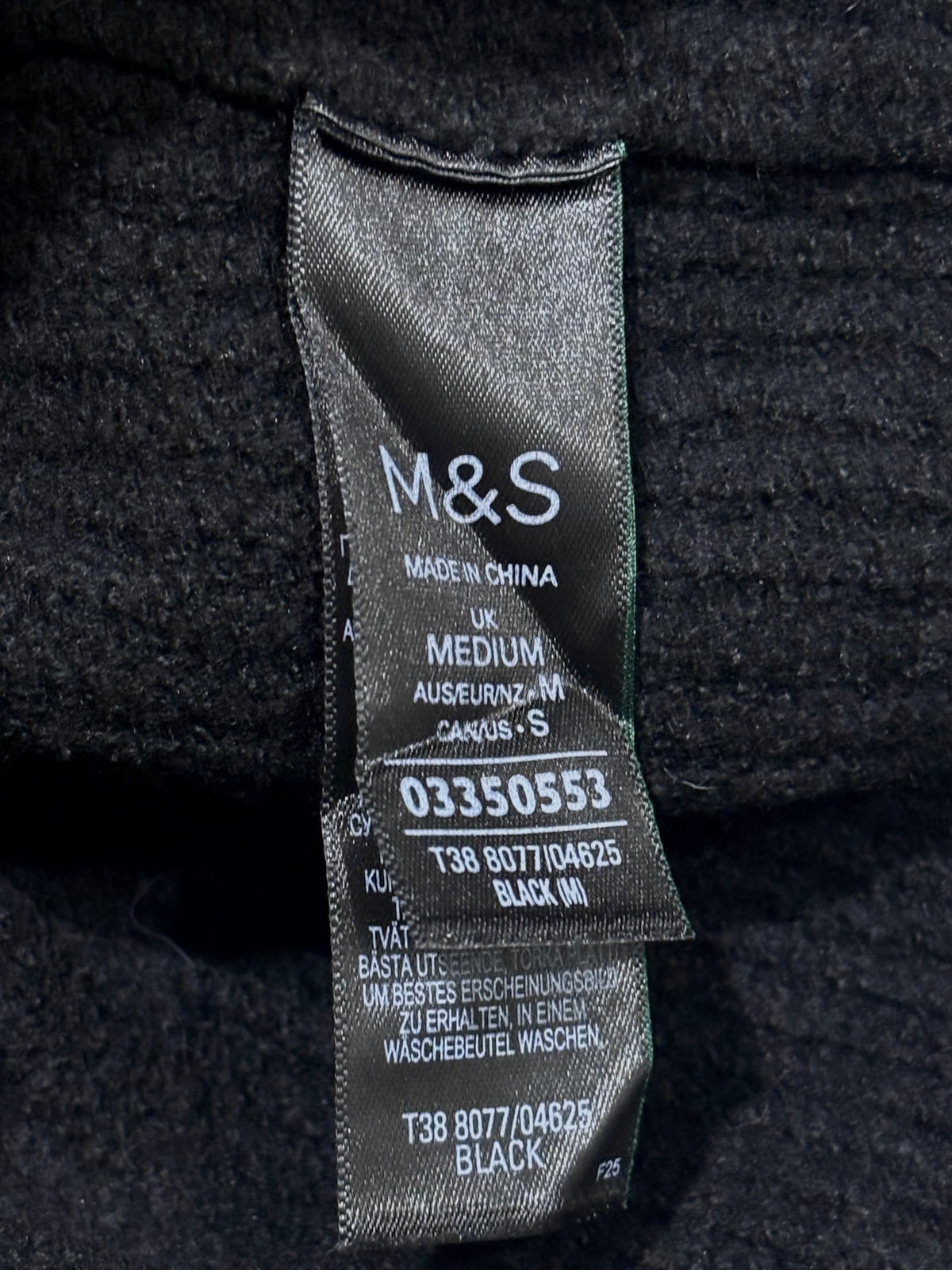 M&S label showing UK MEDIUM and black color