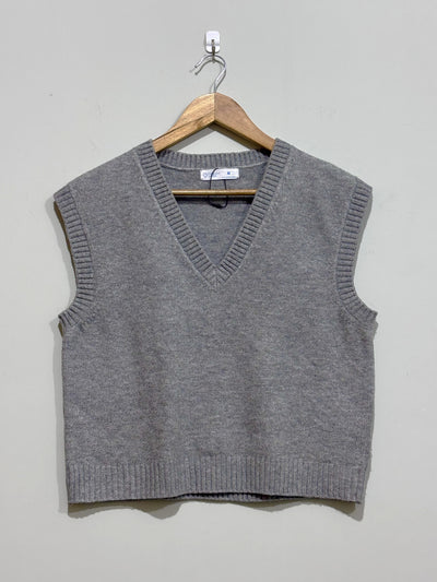 Grey V-neck sleeveless sweater vest with ribbed neckline, armholes and hem