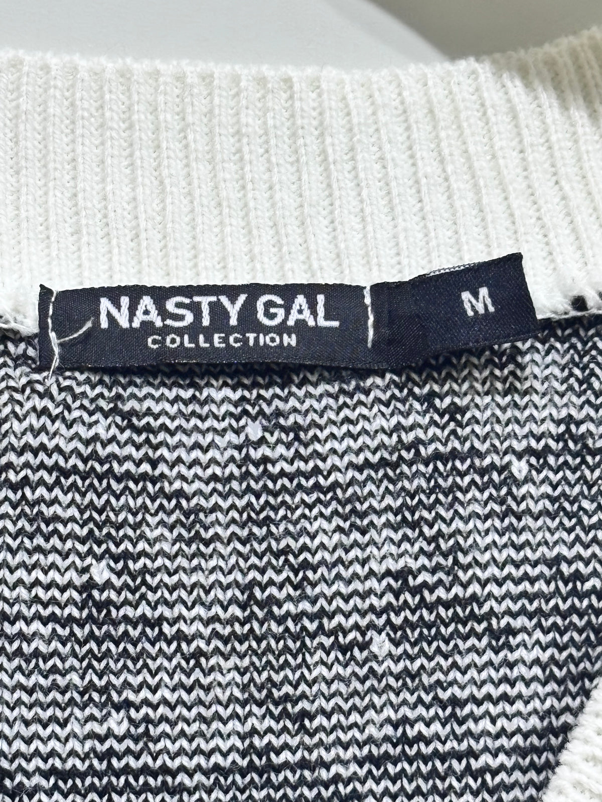 Nasty Gal Collection label showing size M