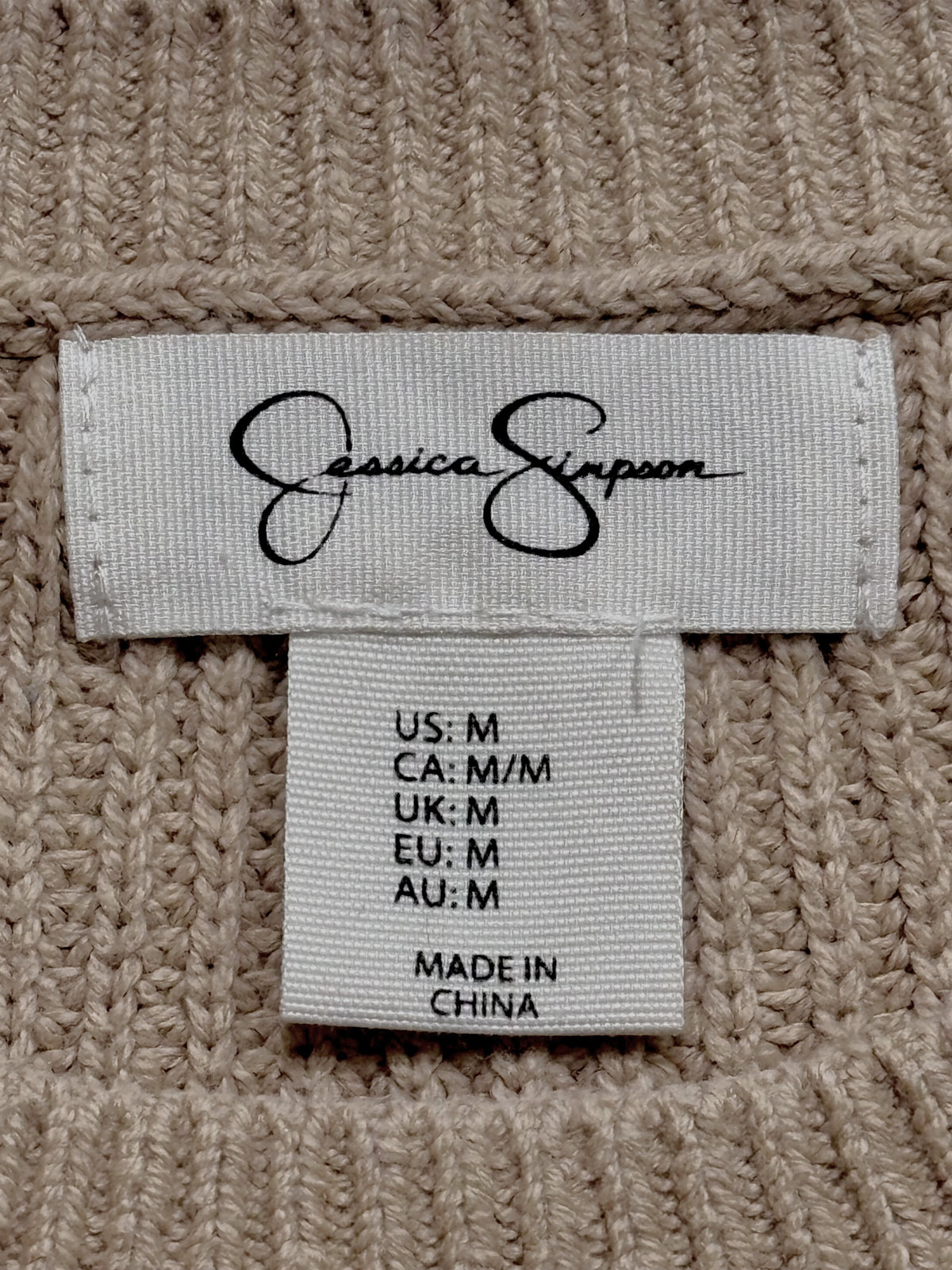 Jessica Simpson brand label showing size M