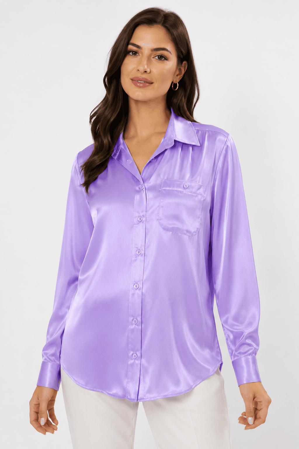 Woman wearing a purple satin shirt against a white background
