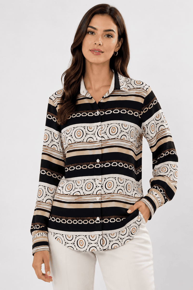 Woman wearing a patterned long-sleeve shirt with a white background