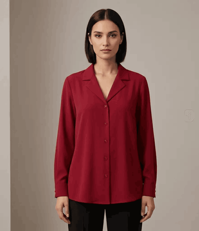 Woman wearing a red blouse against a neutral background