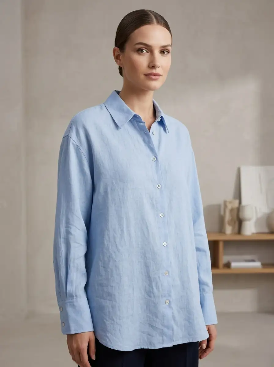 Woman wearing a light blue shirt in an indoor setting