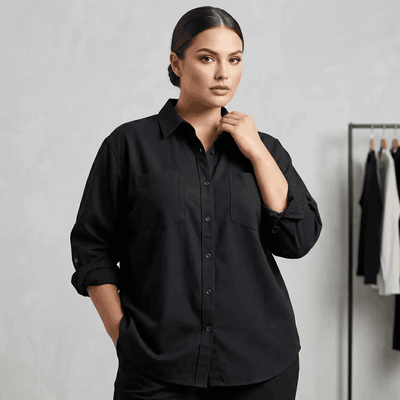 Woman wearing a black shirt against a plain background