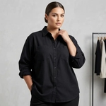 Woman wearing a black shirt against a plain background