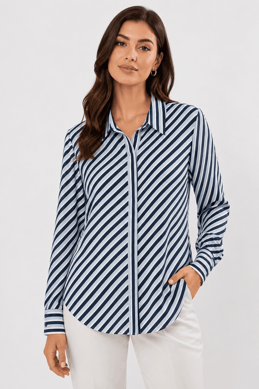 Woman wearing a navy and white striped shirt on a white background