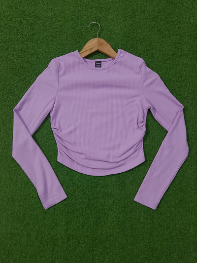 Lavender ribbed ruched long sleeve crop top on hanger